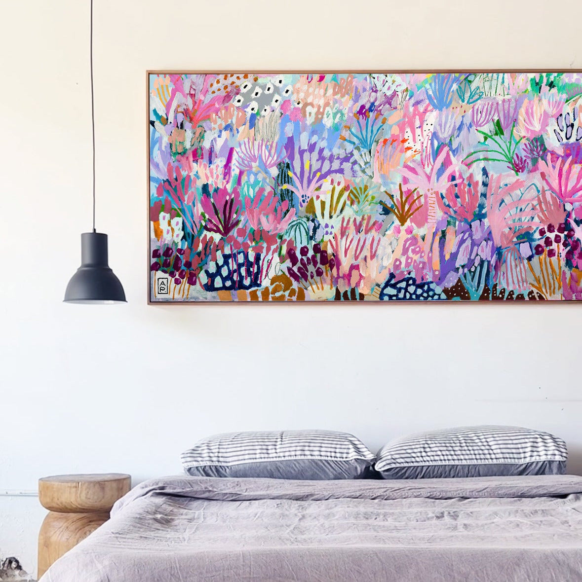 Bedroom with a colorful abstract painting above the bed