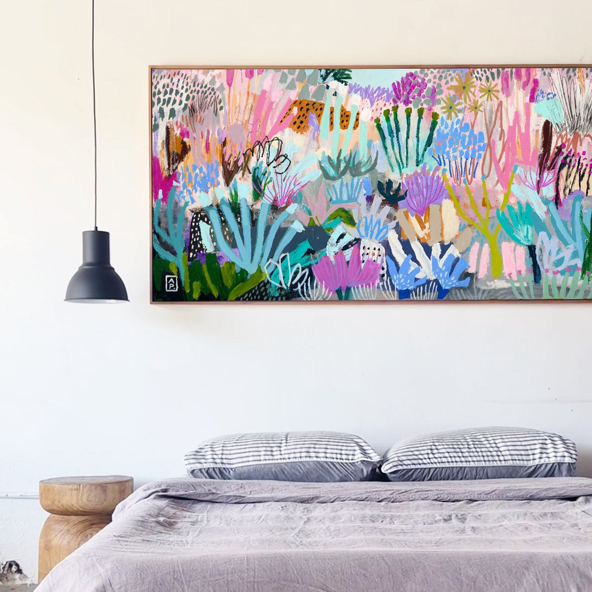 Bedroom with a colorful abstract painting on the wall above a bed.
