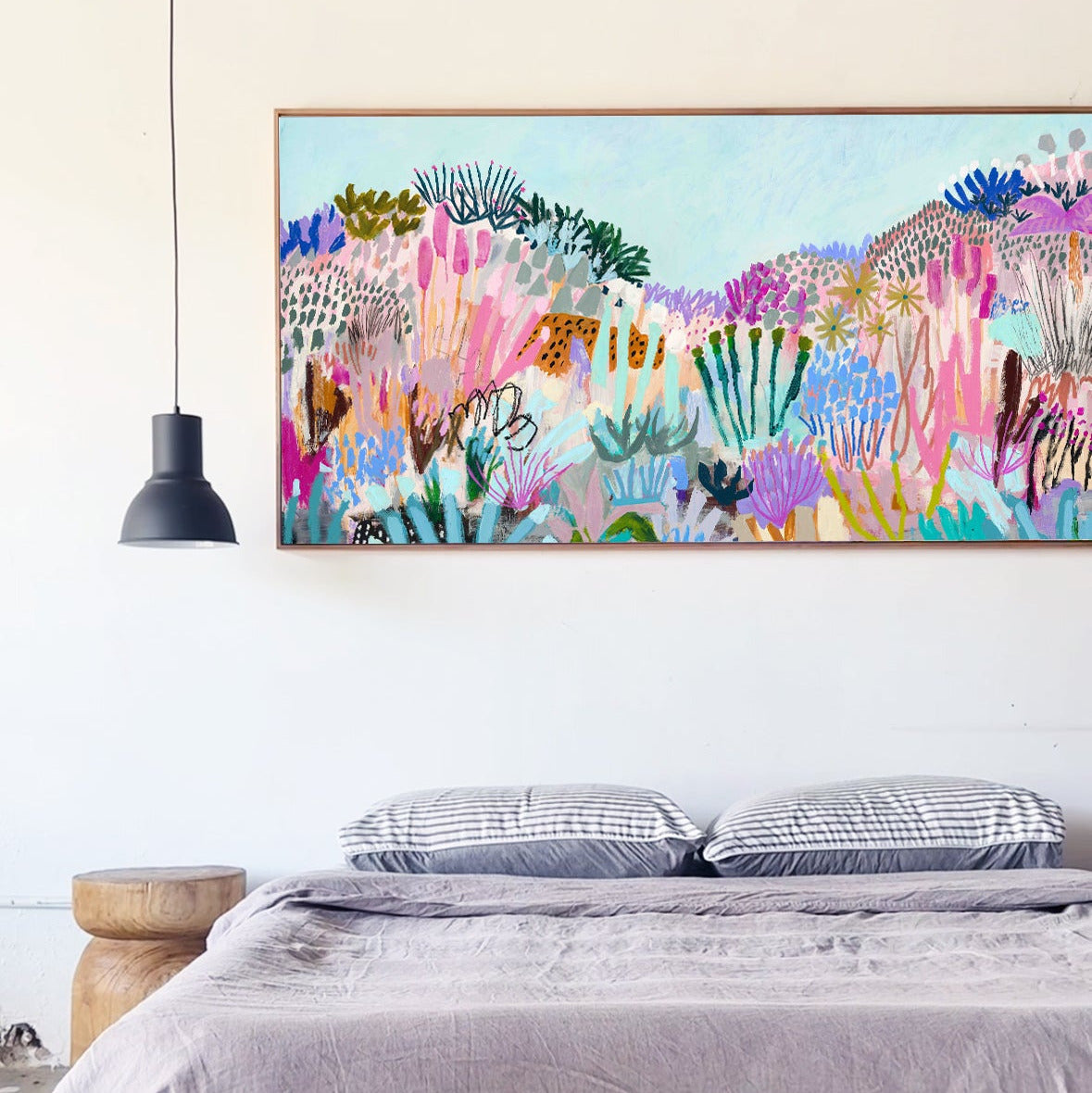 Bedroom with a colorful abstract painting above the bed